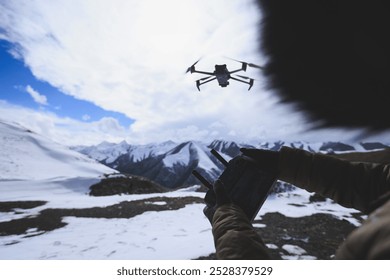 Flying drone in high altitude mountains - Powered by Shutterstock