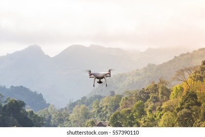 Flying Drone With Mountain And Forest  Background