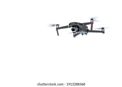 Flying drone quadcopter with a camera isolated on white background.