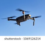 Flying drone up to sky