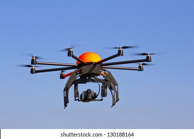 Flying drone in the sky. Flying with an octocopter for video and photo productions