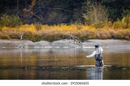 Flying fishing in a beautiful river. - Powered by Shutterstock