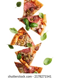 Flying Food. Pizza Slices With Cheese, Sausages, Salami, Olives And Basil In Levitation Close Up Isolated On A Transparent Background. Vertical Orientation