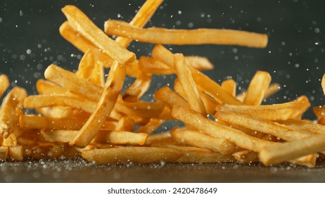 Flying French Fries Falling on Table. Fast Food Concept with Flying Food. - Powered by Shutterstock