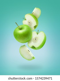 Flying Green Apple Slices On Color Background. Green Apple Photo Art For Poster, Banner