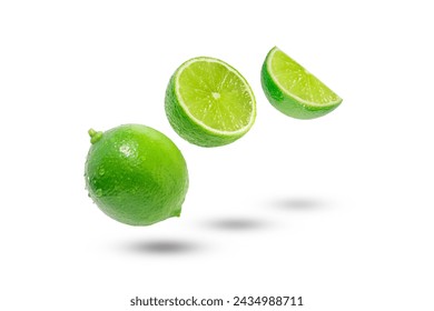 Flying green lime with slices and shadow isolated on white background. - Powered by Shutterstock