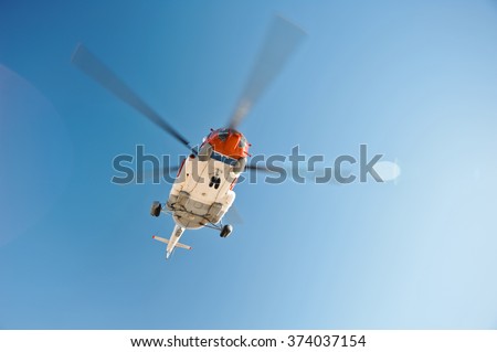 Flying helicopter near an oil platform