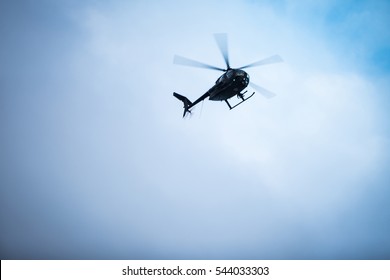 Flying helicopters in the sky.