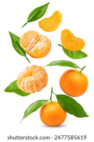 flying mandarins with green leaves and slices isolated on white background. clipping path