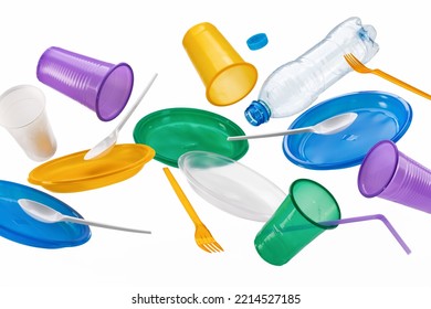 Flying Multi-colored Plastic Utensils, Isolated On A White Background. The Concept Of Ecology And Recycling Of Plastic Waste.