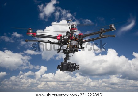 A flying multicopter with raised landing gears and a camera in beautiful cloudy skies