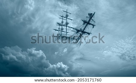 Flying old ship in the stormy dark clouds