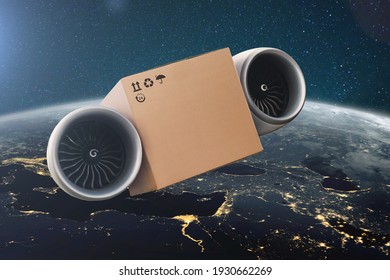 Flying on turbines cardboard box. Super fast express delivery concept. Delivery of cargo in space with amazing blue planet earth.