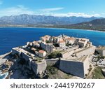 Flying over the northern Corsican town of Calvi, where the sun and sea promise a beautiful backdrop 