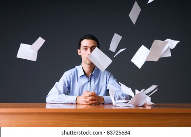 Flying Paper And Businessman In Office