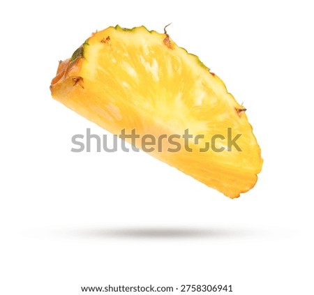 Flying pineapple slice isolated on white background.