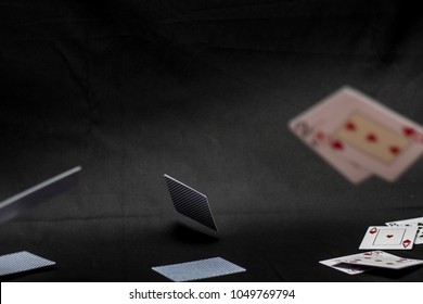 Flying Playing Cards. Black Background