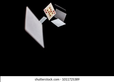 Flying Playing Cards On A Black Background