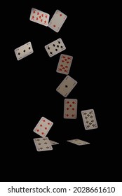 Flying playing cards on a black background