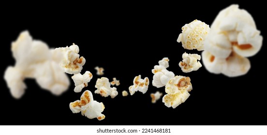 Flying popcorn, isolated on black background - Shutterstock ID 2241468181