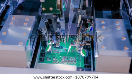 Flying probe test - automation machine equipment for quality testing of printed circuit boards at factory. Automated technology, industrial, robotic, electronic, production, manufacturing concept