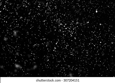 Flying rain or snow on black background - Shutterstock ID 307204151