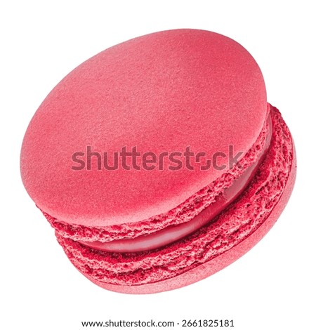 Flying raspberry macaroon isolated on white background. Falling sweet  French  macarons cake or macaroon cookie.