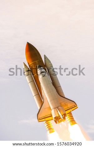 Flying rocket. Rocket launch. The elements of this image furnished by NASA.