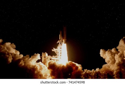 Flying rocket at night. The elements of this image furnished by NASA.