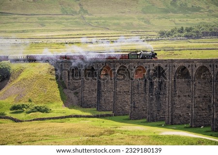 The Flying Scotsman Steam Train crossing The Ribblehead Viaduct, Yorkshire Dales, UK.