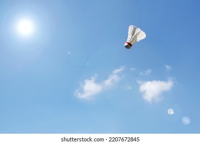 Flying Shuttlecock With Blue Sky Background