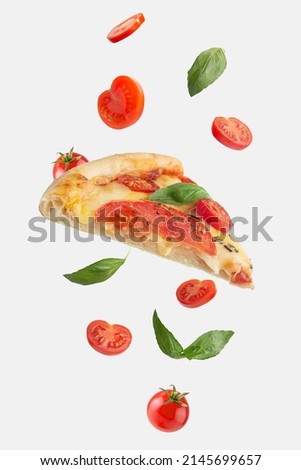 flying slice of margherita pizza with tomatoes and basil