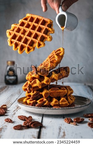 Flying waffles with maple syrup 