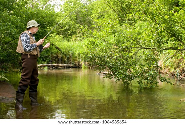 Flyrod Fisherman Fishing On Trout Stream Stock Photo (Edit Now) 1064585654