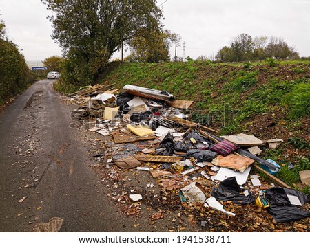 Fly-tipping - Illegal waste crime UK. Dumped waste on natural environment. Environmental Harm and Hazard 