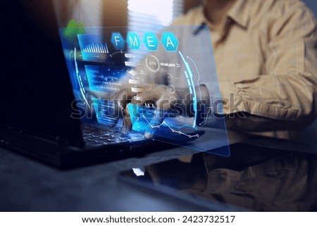 FMEA failure mode and effect analysis concept with programmer or staff working with laptop computer to analyse cause of problem find way to reduce and improve work process better