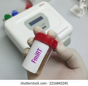 FmiRT(Fecal MicroRNA Test). Doctor Holding Sample Container With Feces Or Stool For Fecal MicroRNA Test As Potential Biomarkers For Intestinal Diseases.