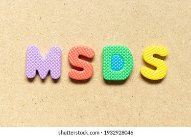 Foam Alphabet Letter In Word MSDS (Abbreviation Of Material Safety Data Sheet) On Wood Background