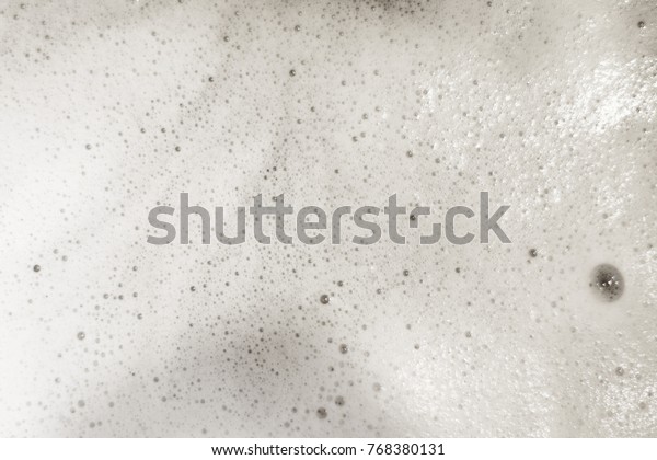 Foam bubble from soap\
or shampoo. Washing and cleaning, suds background, overlay texture.\
Top view, close up