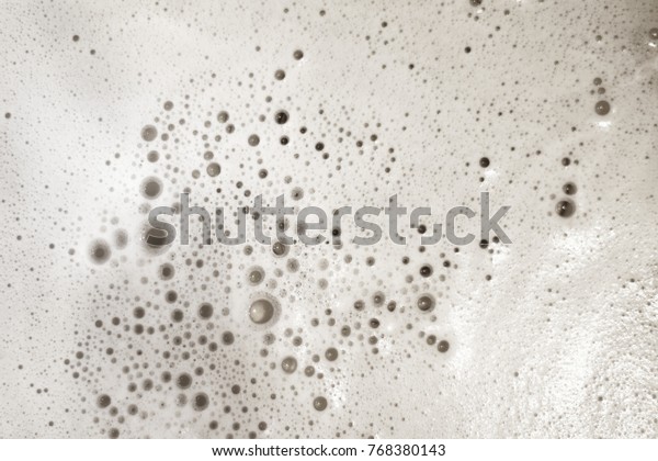 Foam bubble from soap\
or shampoo. Washing and cleaning, suds background, overlay texture.\
Top view, close up