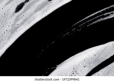 Foam Bubble Wipe Cleaning Washing  On Black Background On Top View Texture Art Abstract