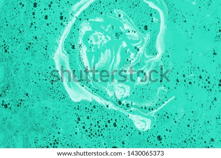 Foam and bubbles form on the surface of bath bomb dissolve in water