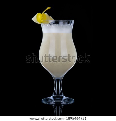 Foam colada, white rum, pineapple juice, coconut syrup on a black background