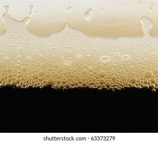 Foam Of Dark Beer With Bubbles