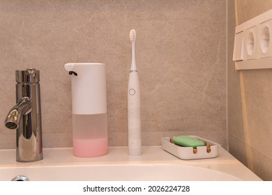 Foam Dispenser, Electric Toothbrush And Soap In Bathroom