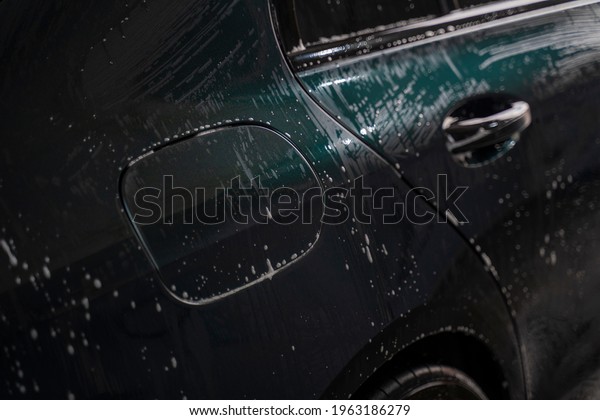 foam drops\
water on the car body in green\
color