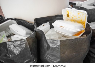 Foam food containers in the bin - Takeaway food and environmental problems concept 