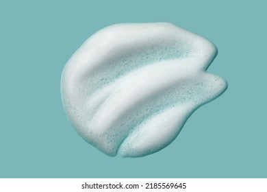 Foam lather texture background. White cleanser gel, shaving foam, shampoo bubbles on blue. - Shutterstock ID 2185569645