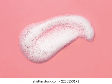 Foam lather texture background. White cleanser gel, shaving foam, shampoo bubbles on pink - Shutterstock ID 2253153171