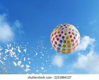 Foam party, colorful inflatable balloon and flying foam on sunny sky background, copy space.